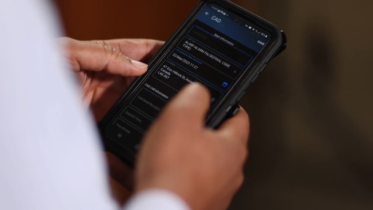 Hands working through a list on a phone app